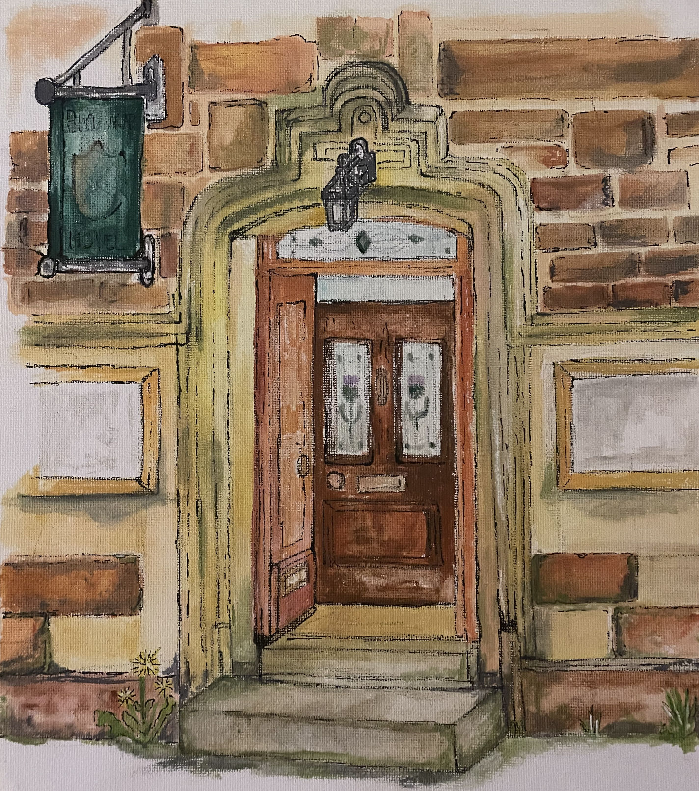 The entrance to the Bannock Hotel, looking tired and worn and with weeds growing outside.